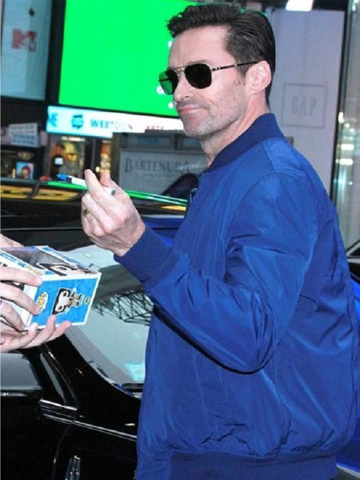 Hugh Jackman Wearing blue leather jacket